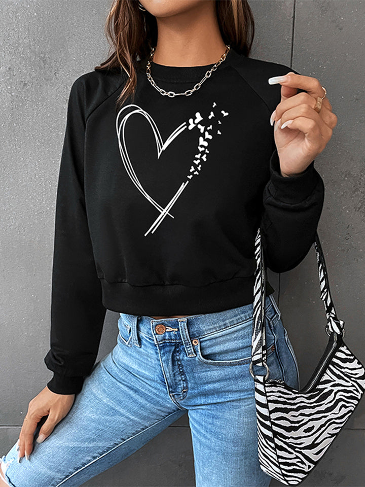 Trendsi Cupid Beauty Supplies Black / XS Woman Blouse Round Neck Raglan Sleeve Heart Graphic Sweatshirt